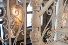 Ornate iron newel post located on the first floor landing of the Grain Belt brew house