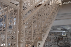 Original iron work stairway running up from the first floor in the Grain Belt brew house