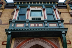 Gothic arch of the front entrance below the oriel window on Old Main Hall at Hamline University