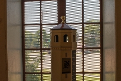 Replica of the Highland Park water tower in window of the ground level interior