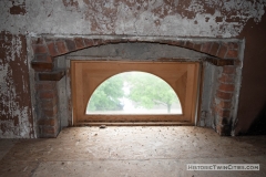 Top arch of what was a second floor window that is now located in the unfinished third floor of the old Dakota County Courthouse due to a renovation