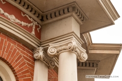 Greek Ionic columns and dentil stonework on the dome of the old Dakota County Courthouse