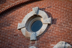 Round window on the front facade of the old Dakota County Courthouse