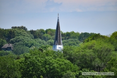 View of the steeple of the Historic Church of St. Peter from the south on the Mendota Bridge spanning the Minnesota River