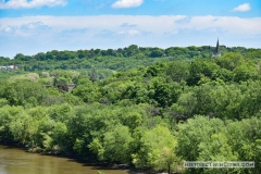 View of the steeple of the Historic Church of St. Peter from the south on the Mendota Bridge spanning the Minnesota River