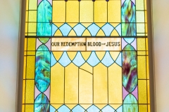 Stained glass window as viewed from inside the Historic Church of St. Peter in Mendota