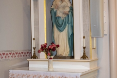 Statue of Mary holding the baby Jesus inside the Historic Church of St. Peter in Mendota