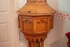 Baptismal font in the sanctuary of the Historic Church of St. Peter in Mendota