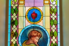 Stained glass window as viewed from inside the Historic Church of St. Peter in Mendota