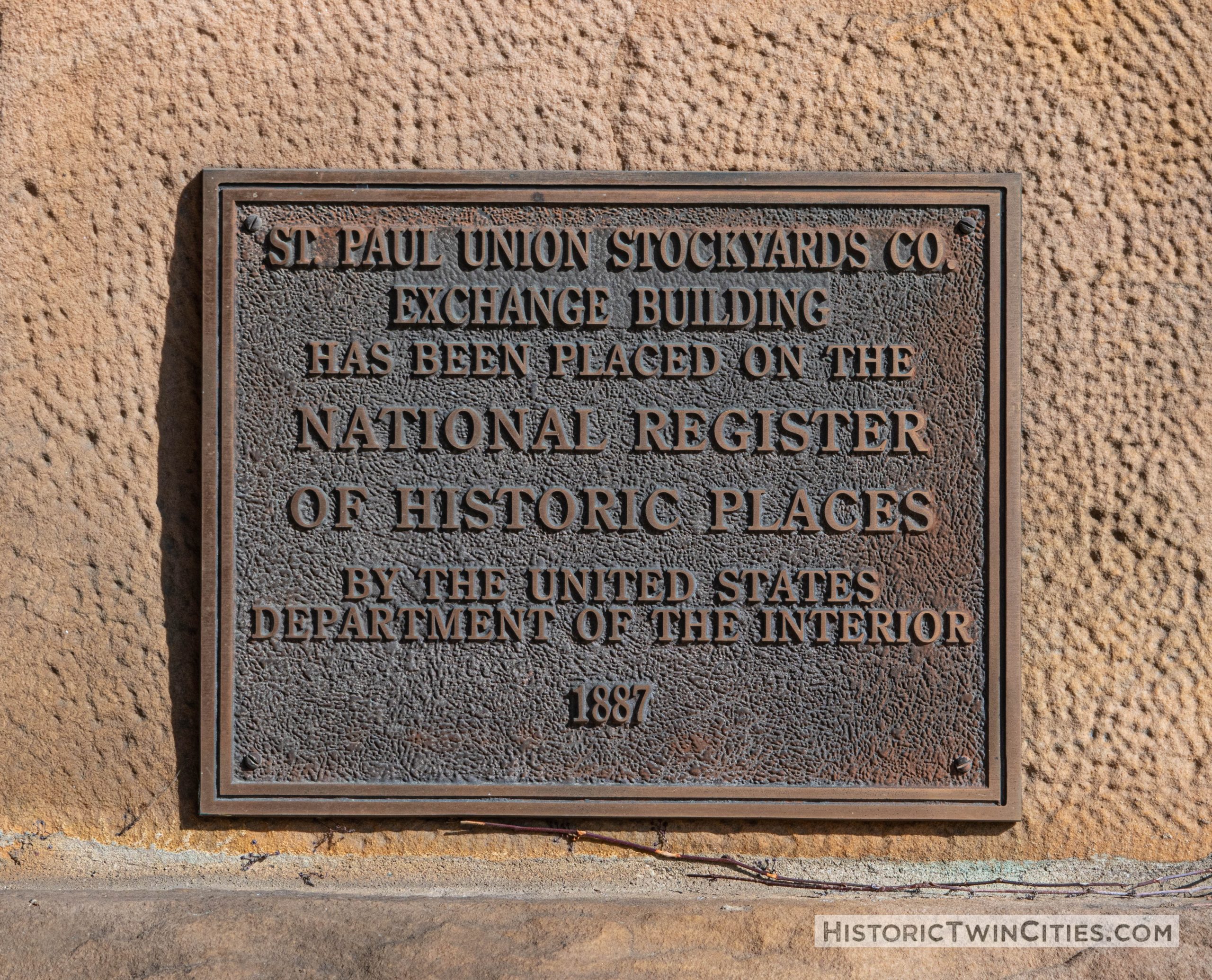 NRHP plaque near the west entrance to the Stockyards Exchange Building - South St. Paul