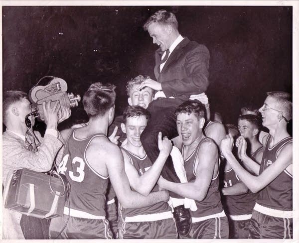 Edgerton team celebrates on the floor of Williams Arena 1960